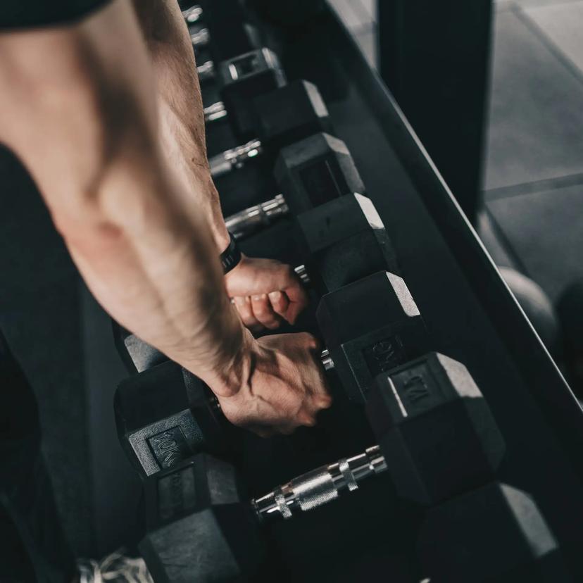 a man unracking some dumbells